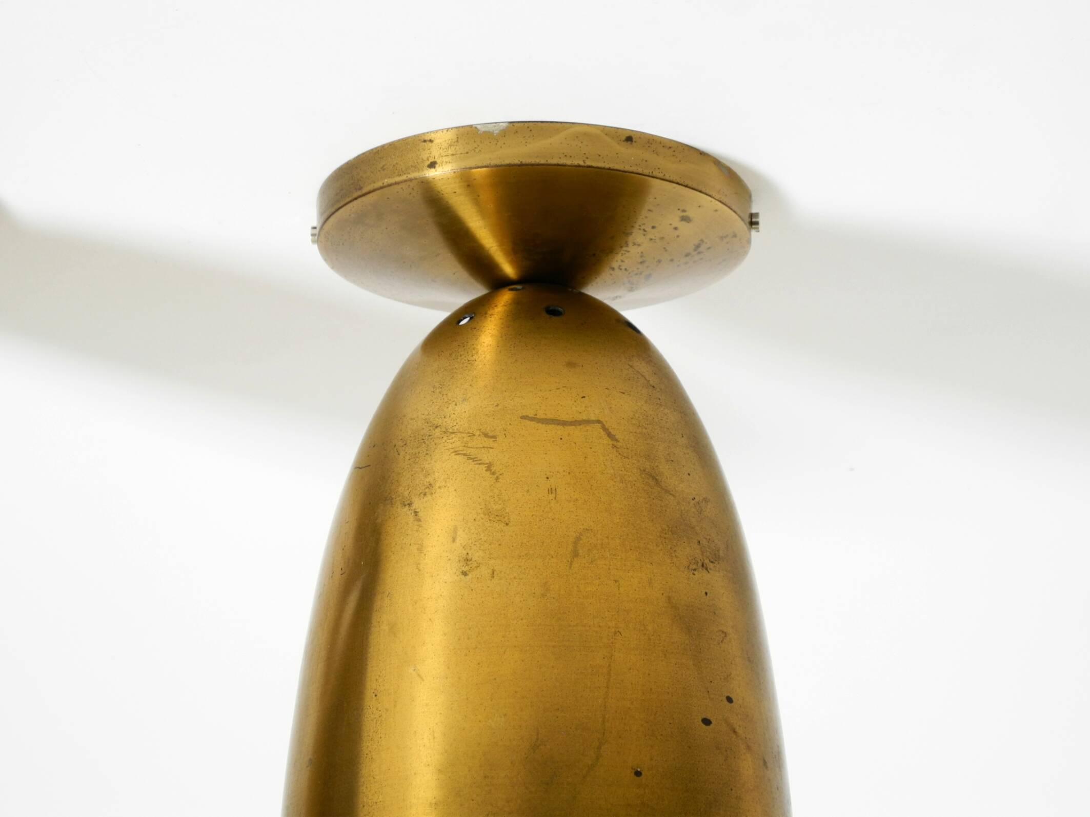 A pair of large, original Mid Century Modern brass ceiling lamps