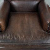 Set of two characterful sheepskin armchairs with a beautiful deep colour