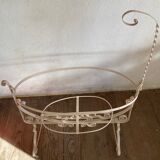 Old wrought iron cradle painted