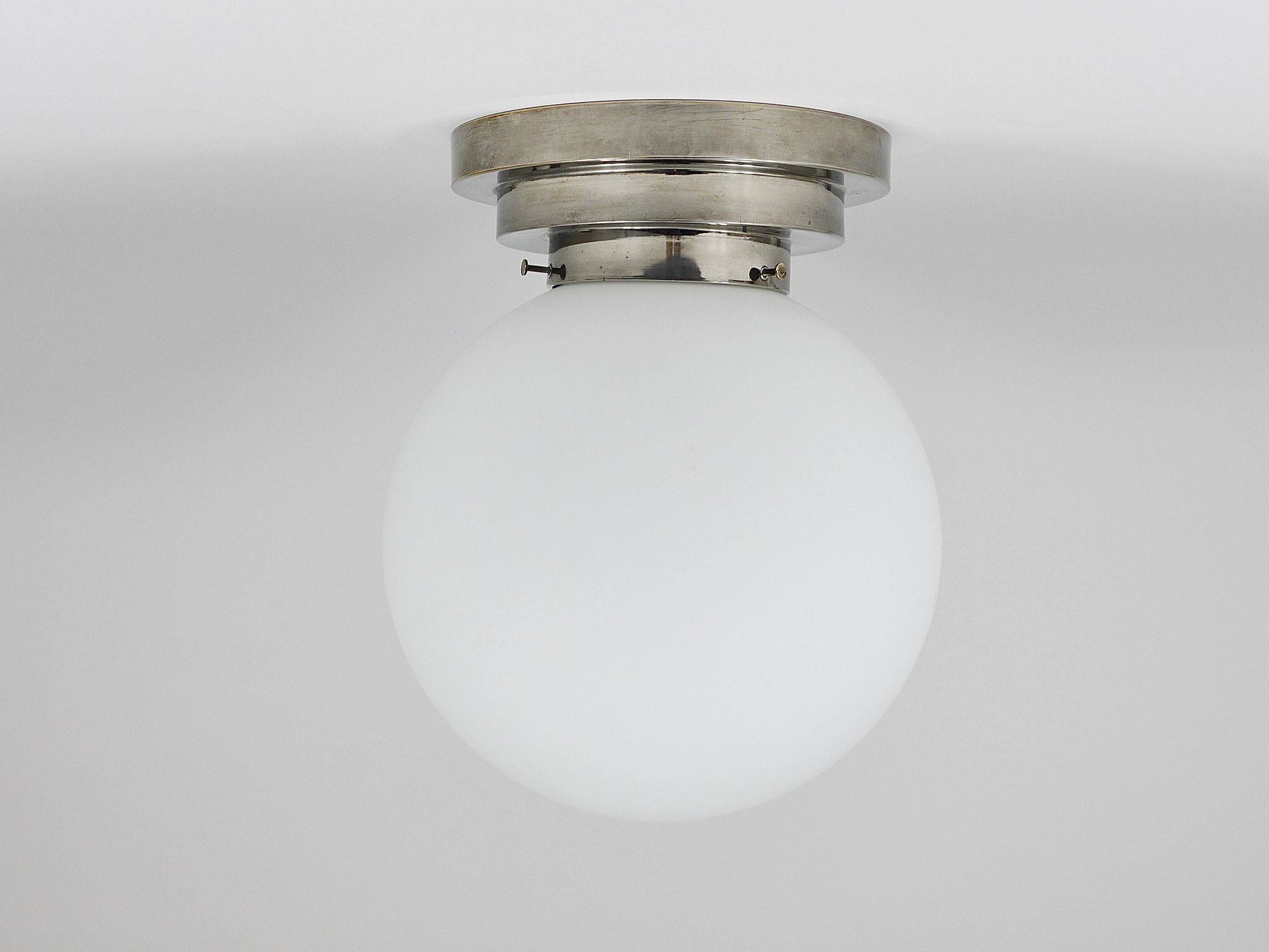 Large opaline glass globe ceiling lamp in Art Deco style.