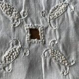 Former embroidered doily