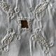 Former embroidered doily