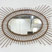 Grand miroir soleil en rotin 1960
