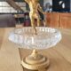 Footed catch-all / ashtray with cherub (glass and gilded metal)