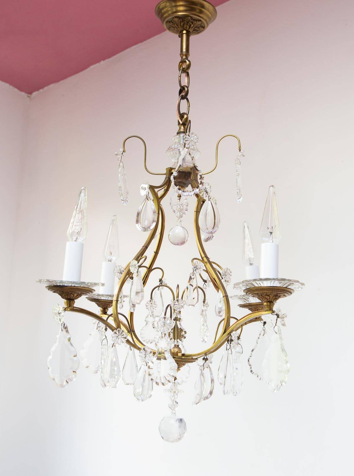 Old French chandelier in gilded brass with tassels