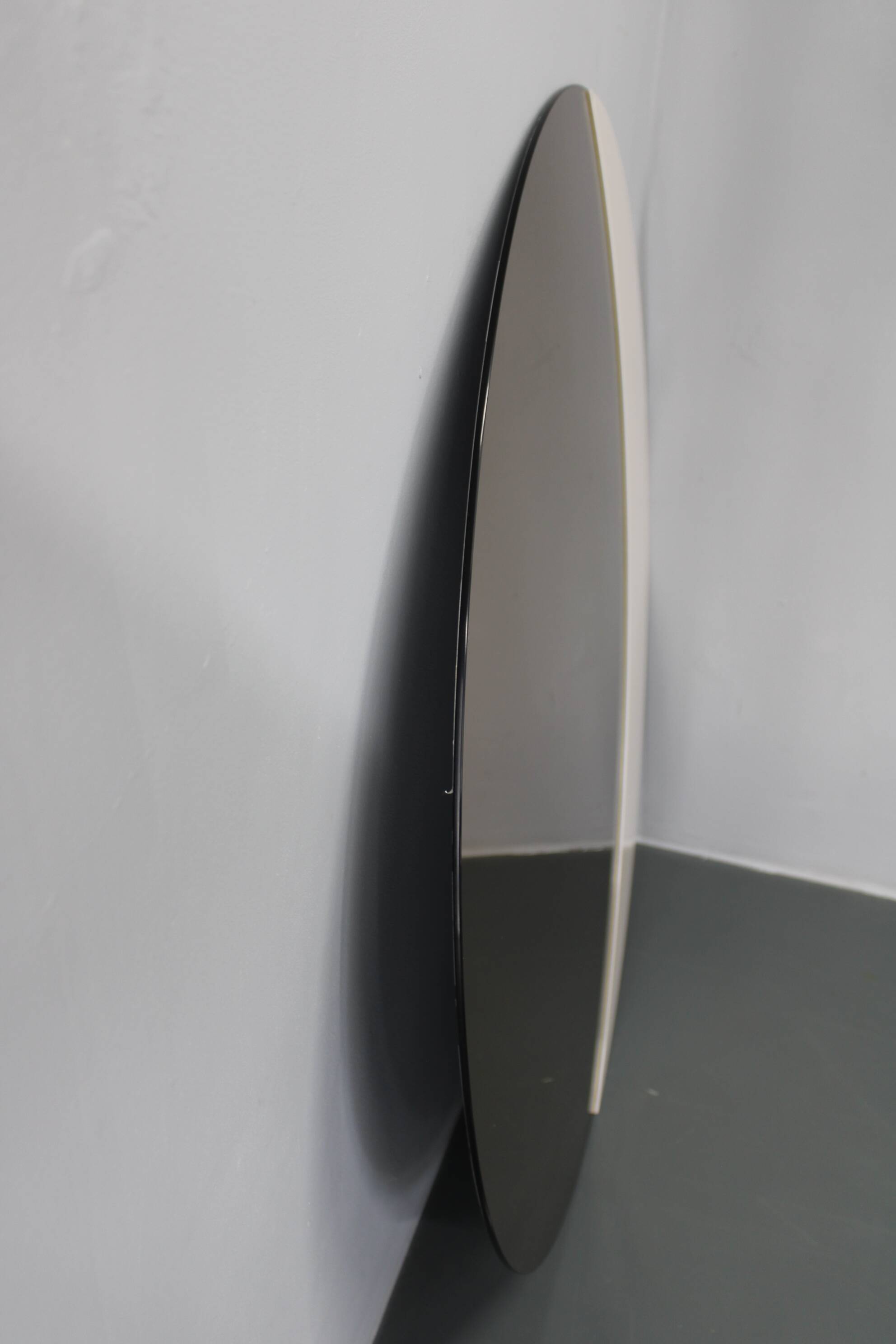 Large 1980s Italian smoke-tinted round mirror with white geometric segment