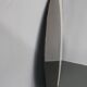 Large 1980s Italian smoke-tinted round mirror with white geometric segment