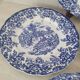 4 earthenware plates with floral and pastoral scene motif
