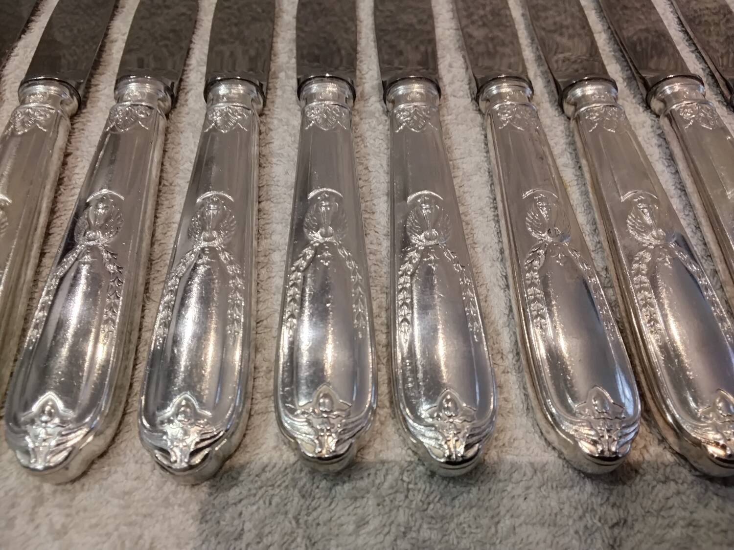 12 silver-plated metal table knives by the silversmith Ravinet Denfert, Empire style, model 81.