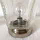 Pair of lantern-style ceiling lights or antique lamps.
