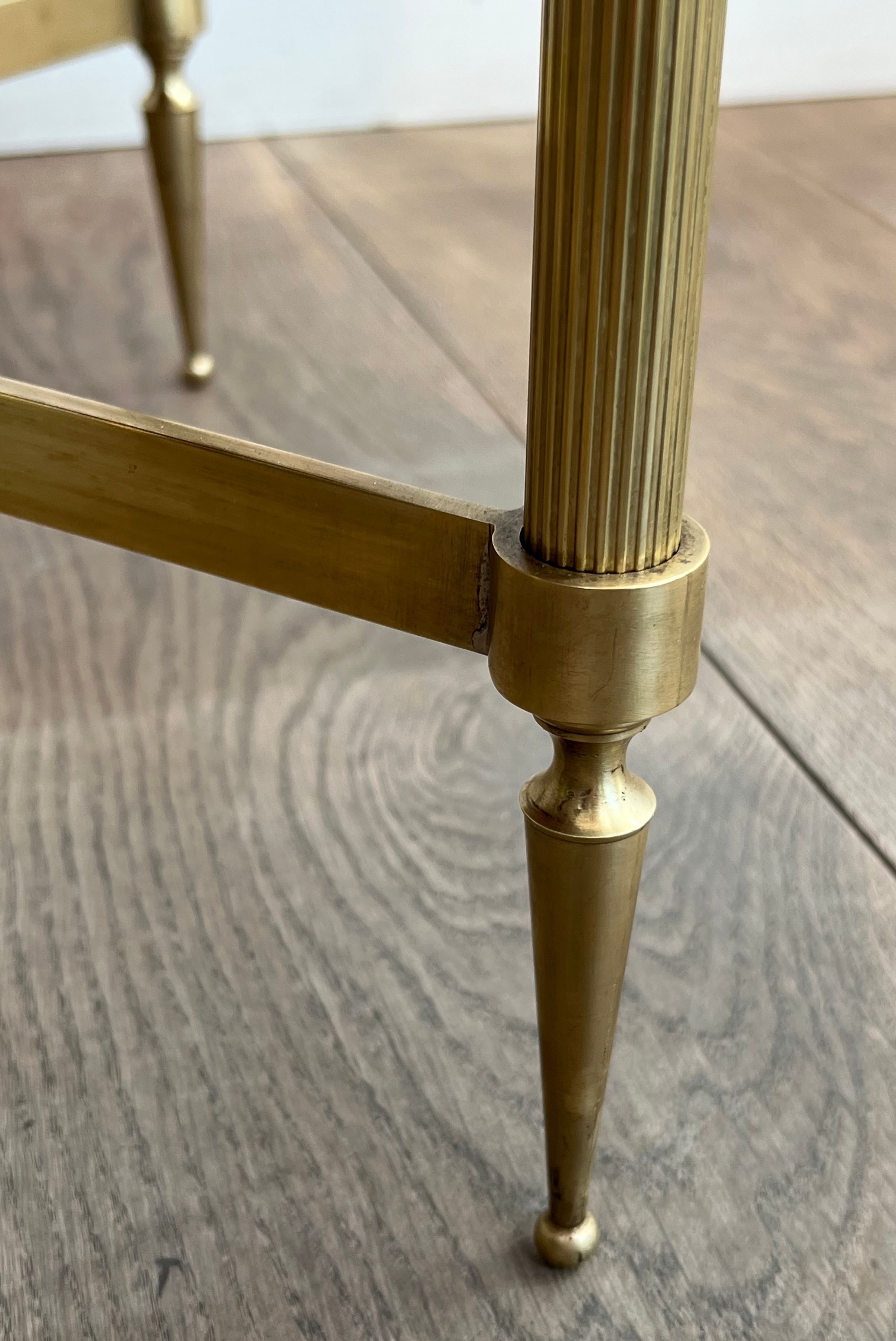Neoclassical style round coffee table in brass with a white Carrara marble top from Jansen