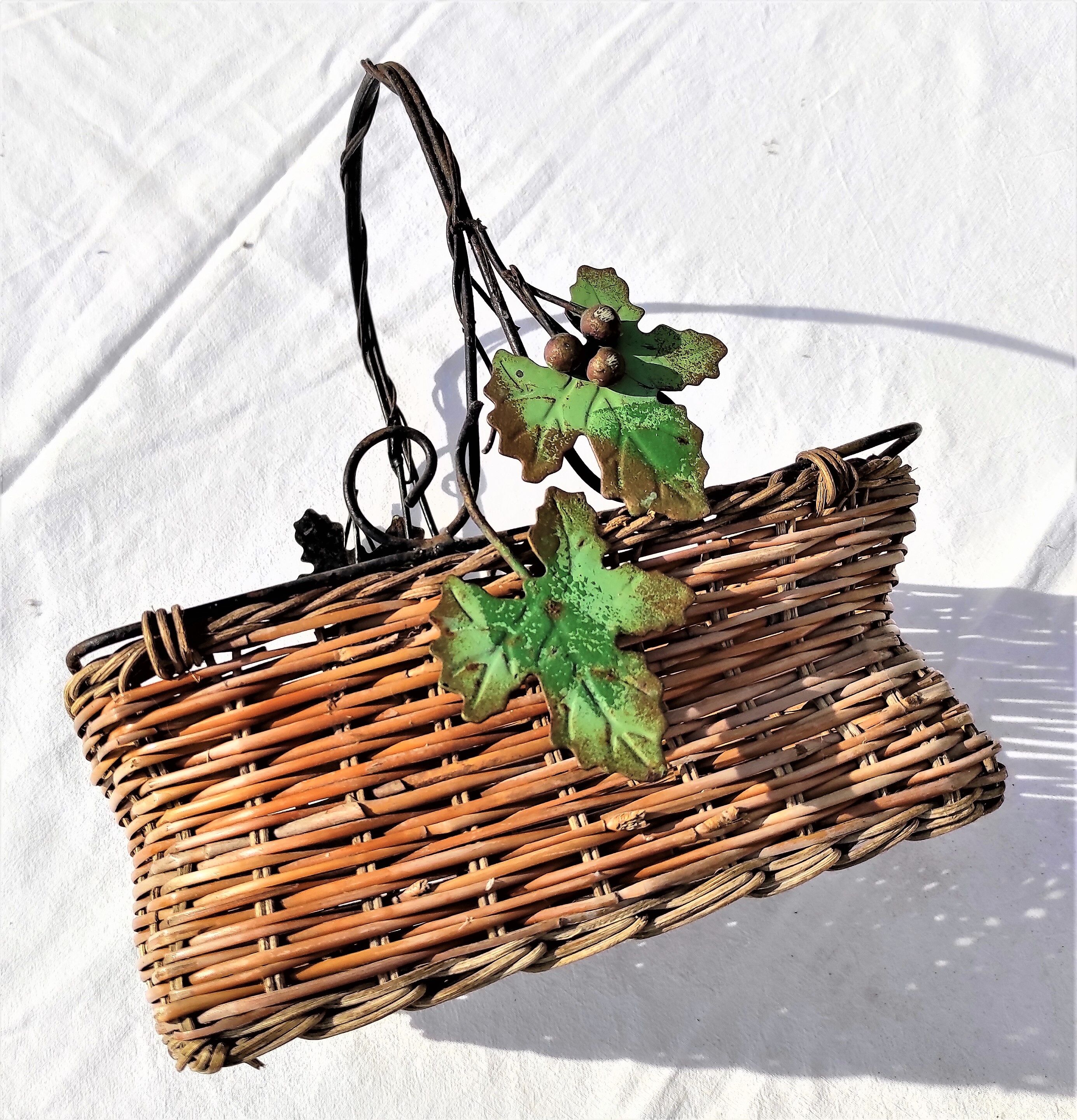 Old wicker basket decoration vine leaves and grapes