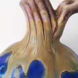Vintage decanter in enamelled earthenware