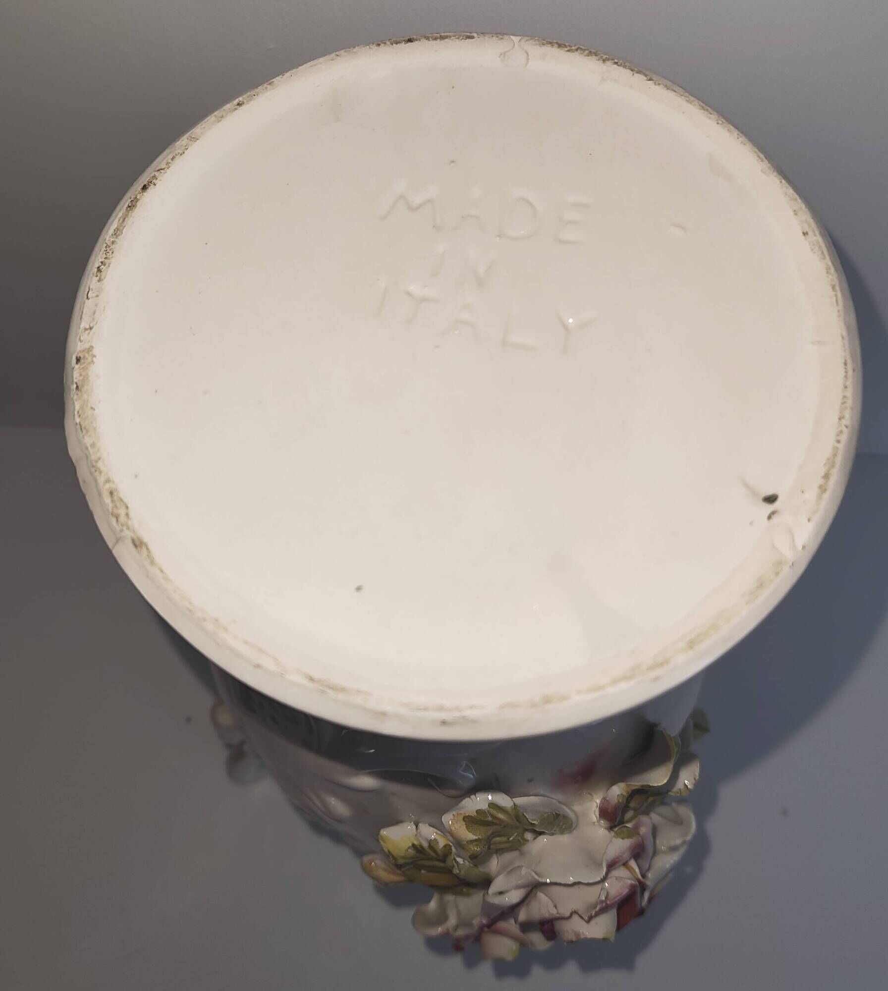 Vintage Italian white ceramic vase with raised floral decoration.