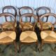 Suite de 6 chaises Louis Philippe paillées en noyer