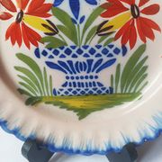 Pair of antique plates in popular earthenware with a floral basket decoration on the edge.