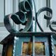 Wrought iron wall lantern & amber cathedral glass