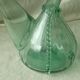 Blown glass carafe with a goat design.