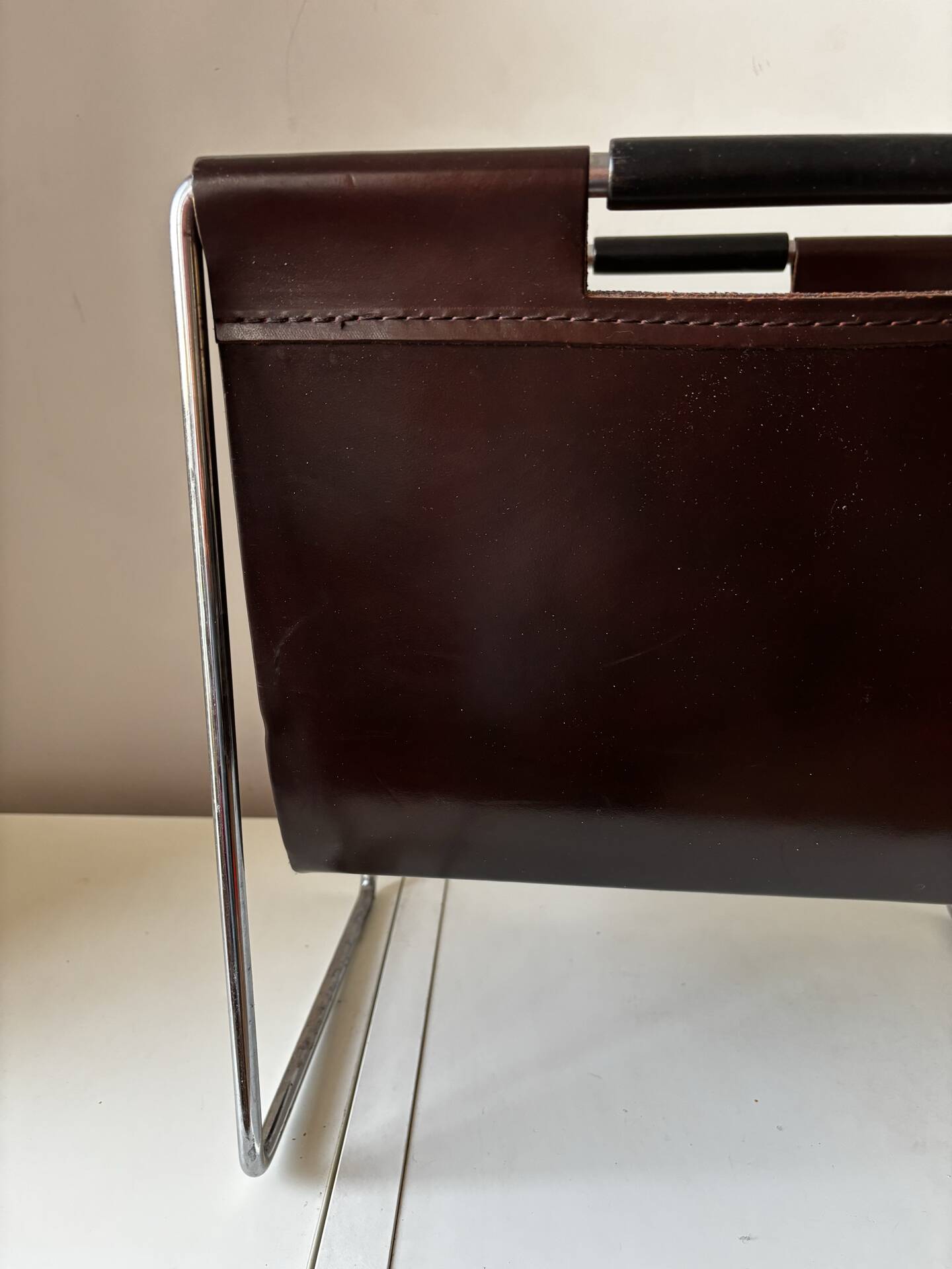 Leather and chrome magazine rack Brabantia