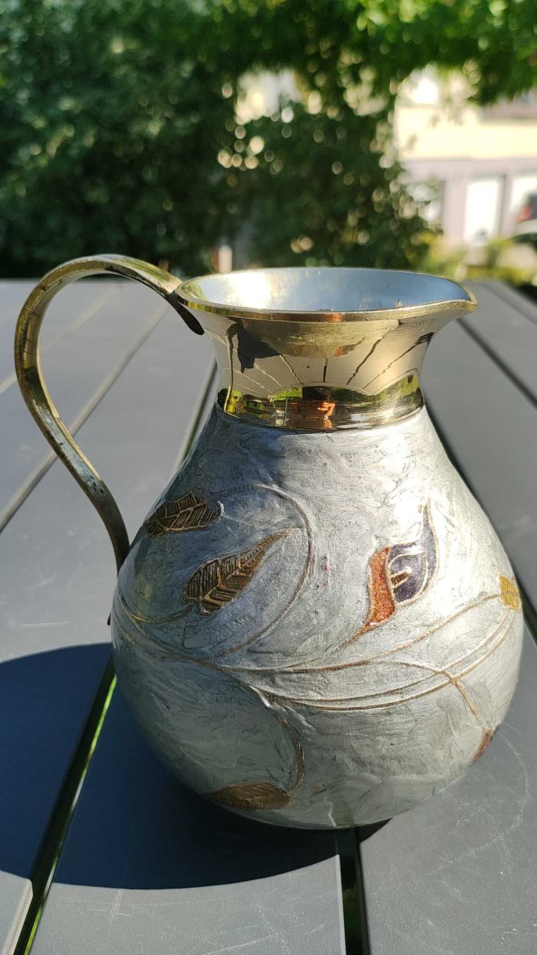Decorative decanter in solid enamelled brass