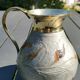 Decorative decanter in solid enamelled brass