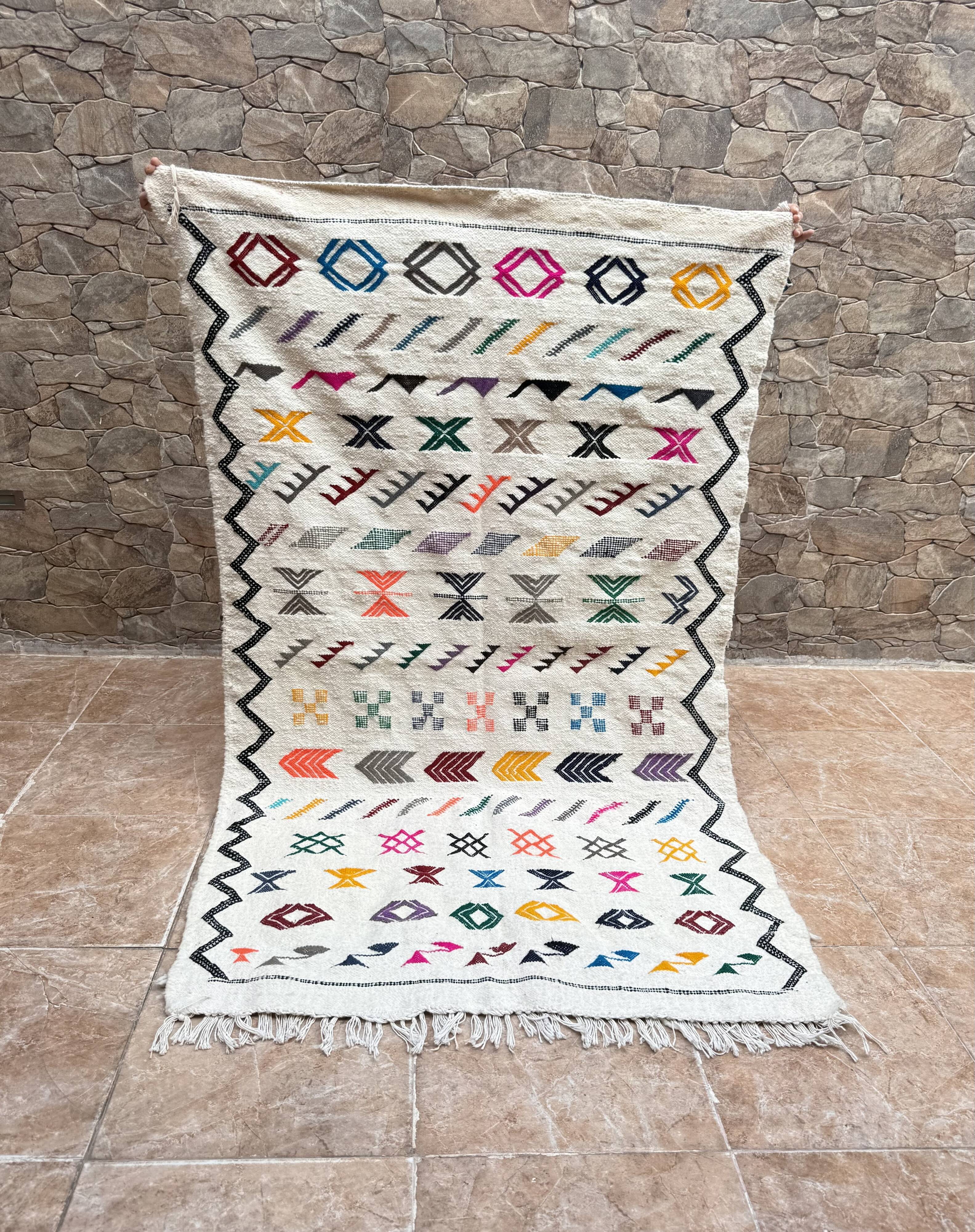 Handwoven Berber kilim rug: small Moroccan decorative rug.