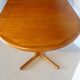 Expandable round table in teak