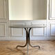 Table ronde en verre fumé et chrome