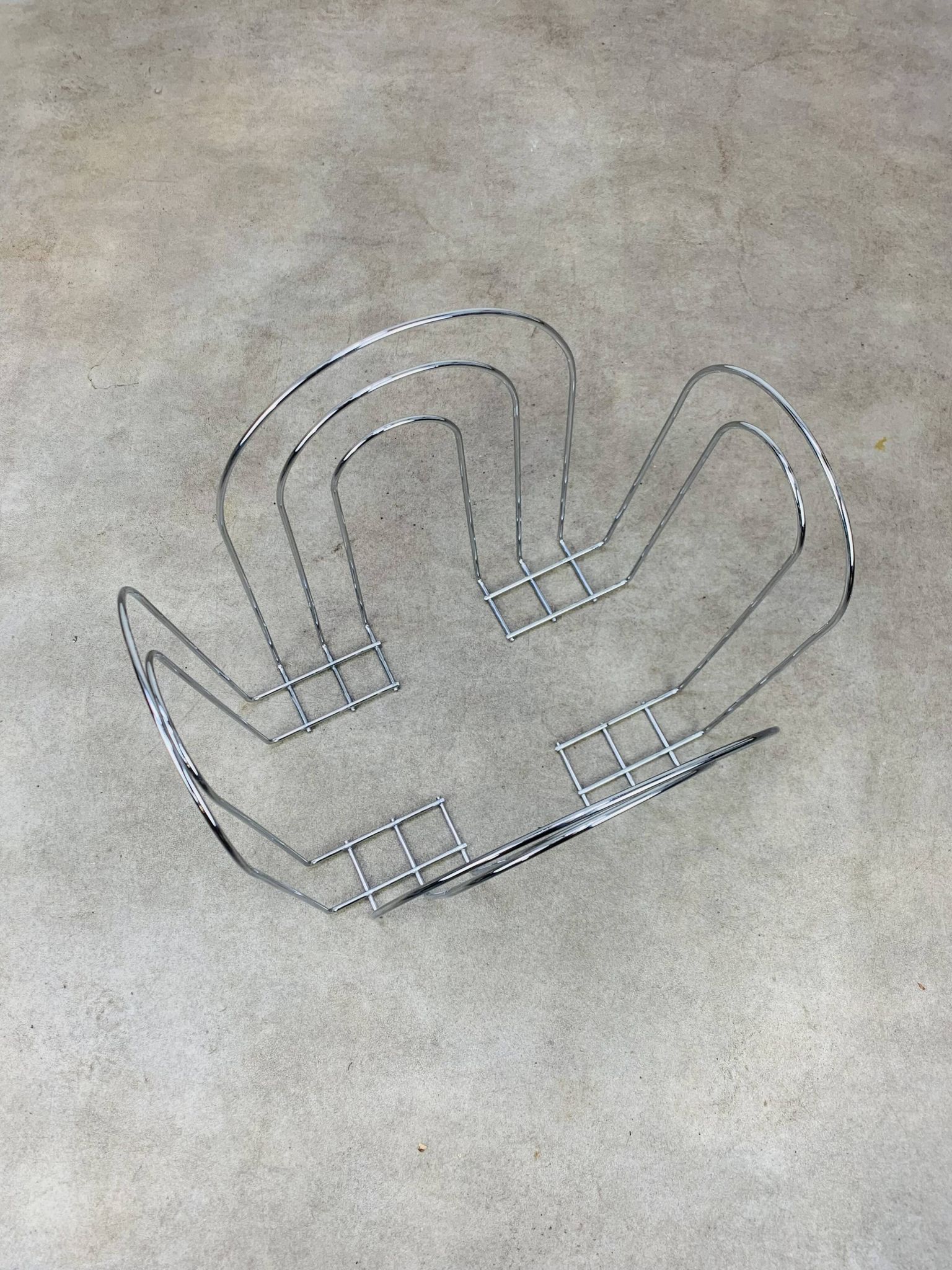 Postmodern chrome metal magazine rack from the 80s