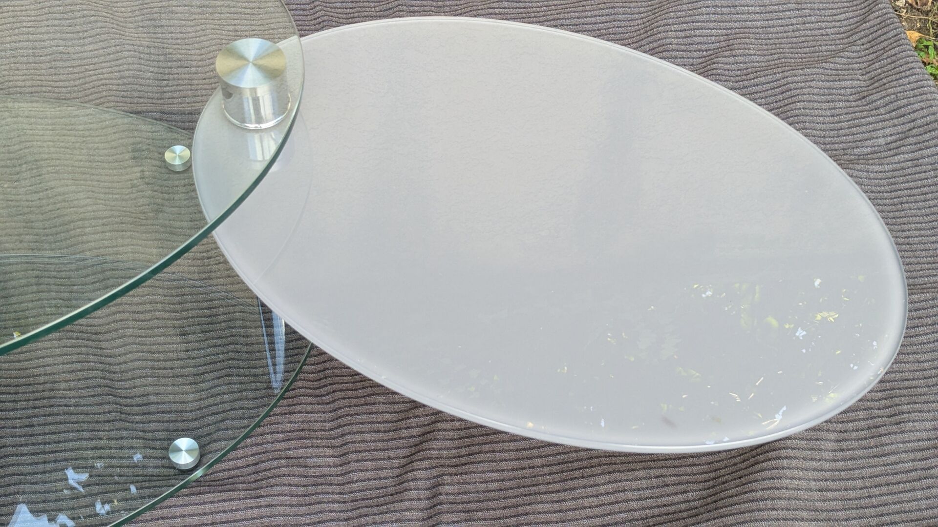 Coffee table with rotating glass tops by Antoine Motard.