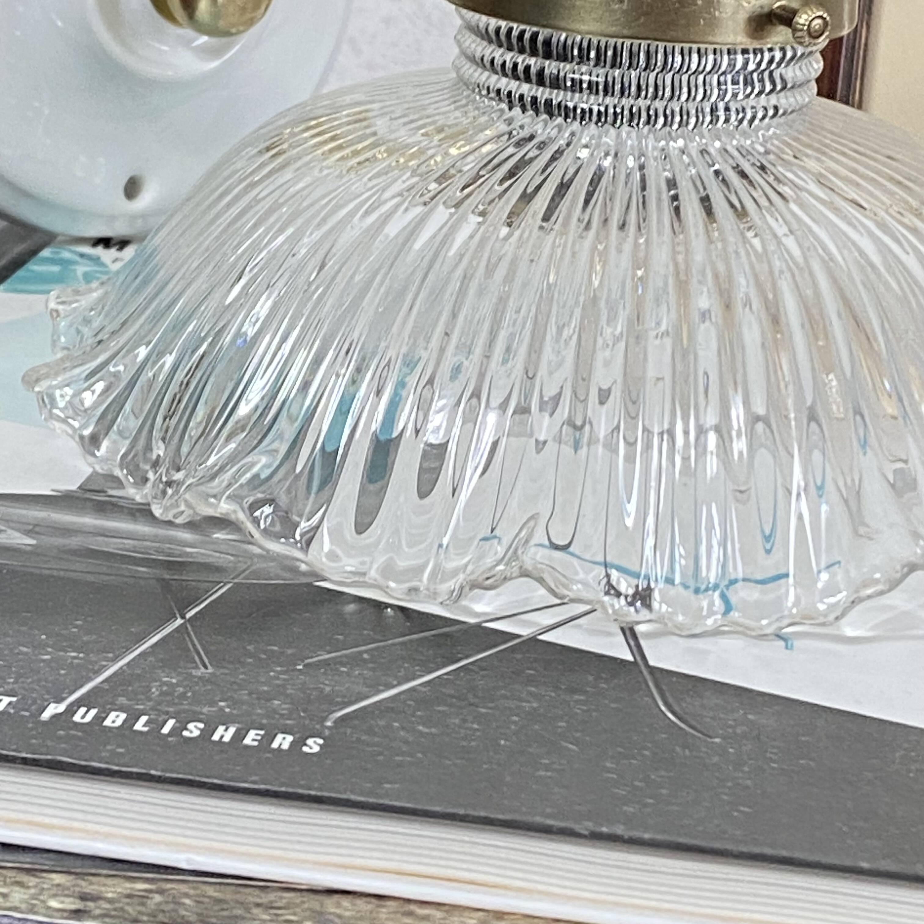Swan neck wall light in brass with a ribbed glass shade, Holophane type.