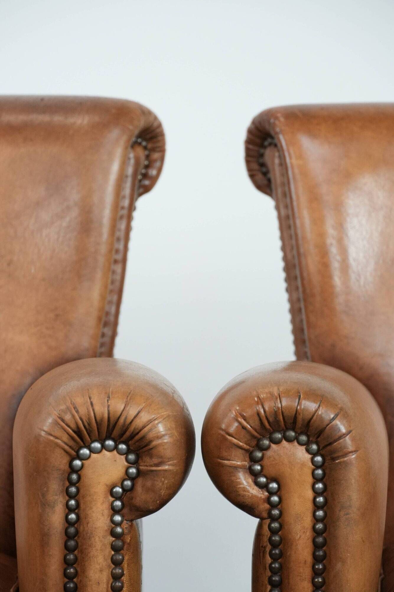 Set of two vintage sheepskin armchairs with beautiful and warm colours
