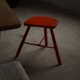 Pair of patinated wooden stools painted red with flared legs, 1950s-1960s.