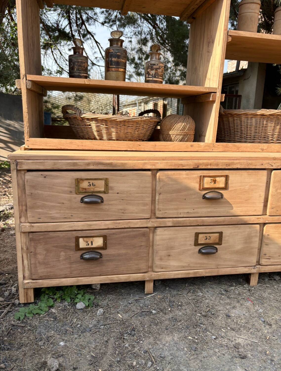 Large antique workshop furniture with drawers and shelves.