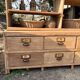Large antique workshop furniture with drawers and shelves.