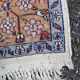 Handmade Persian rug in blue, beige, burgundy, and orange, 95x160cm.