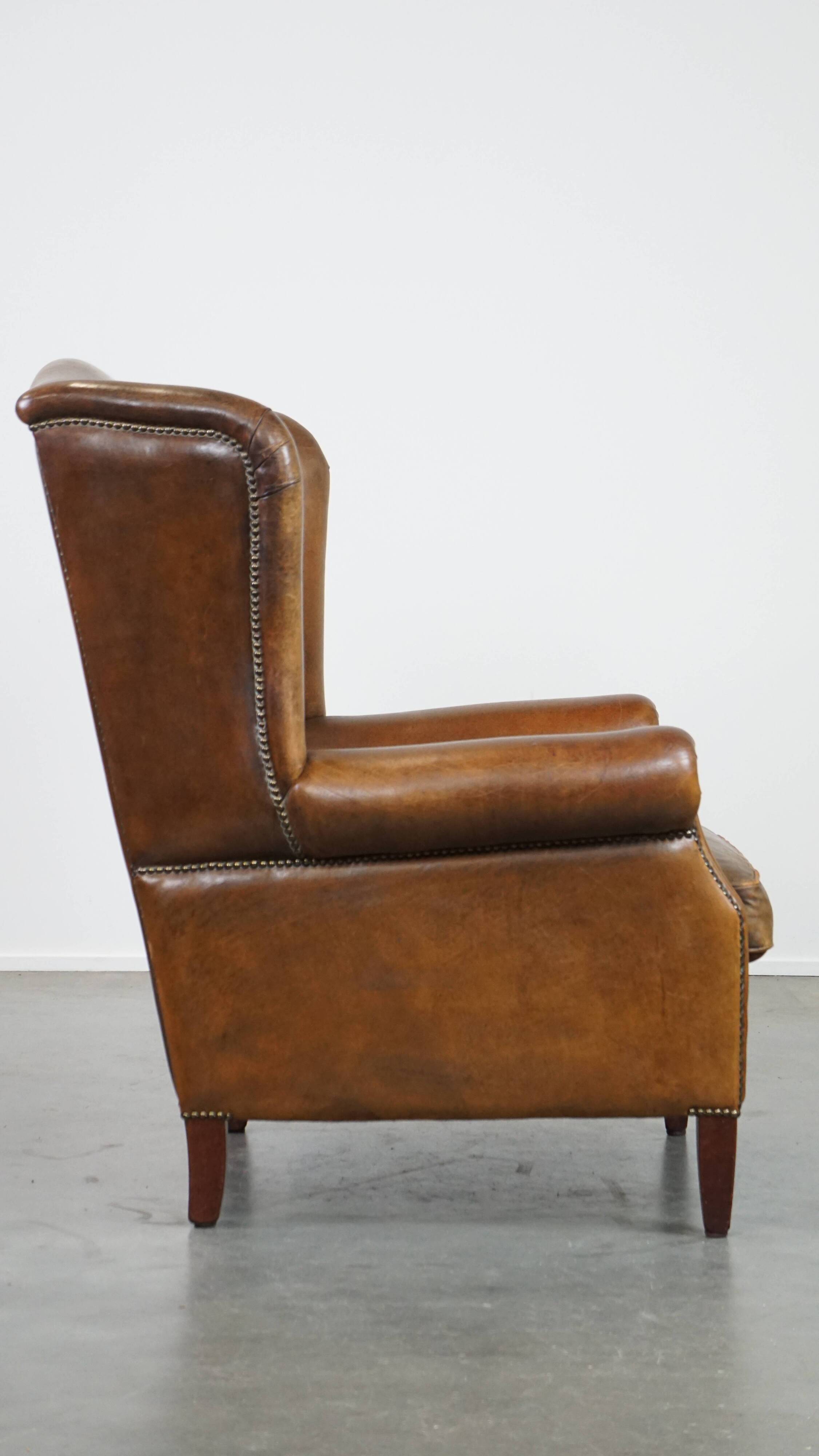 Sheep leather wingback chair with patina