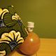 Solid wood ball lamp, lampshade with stylised wax flowers in khaki/yellow.