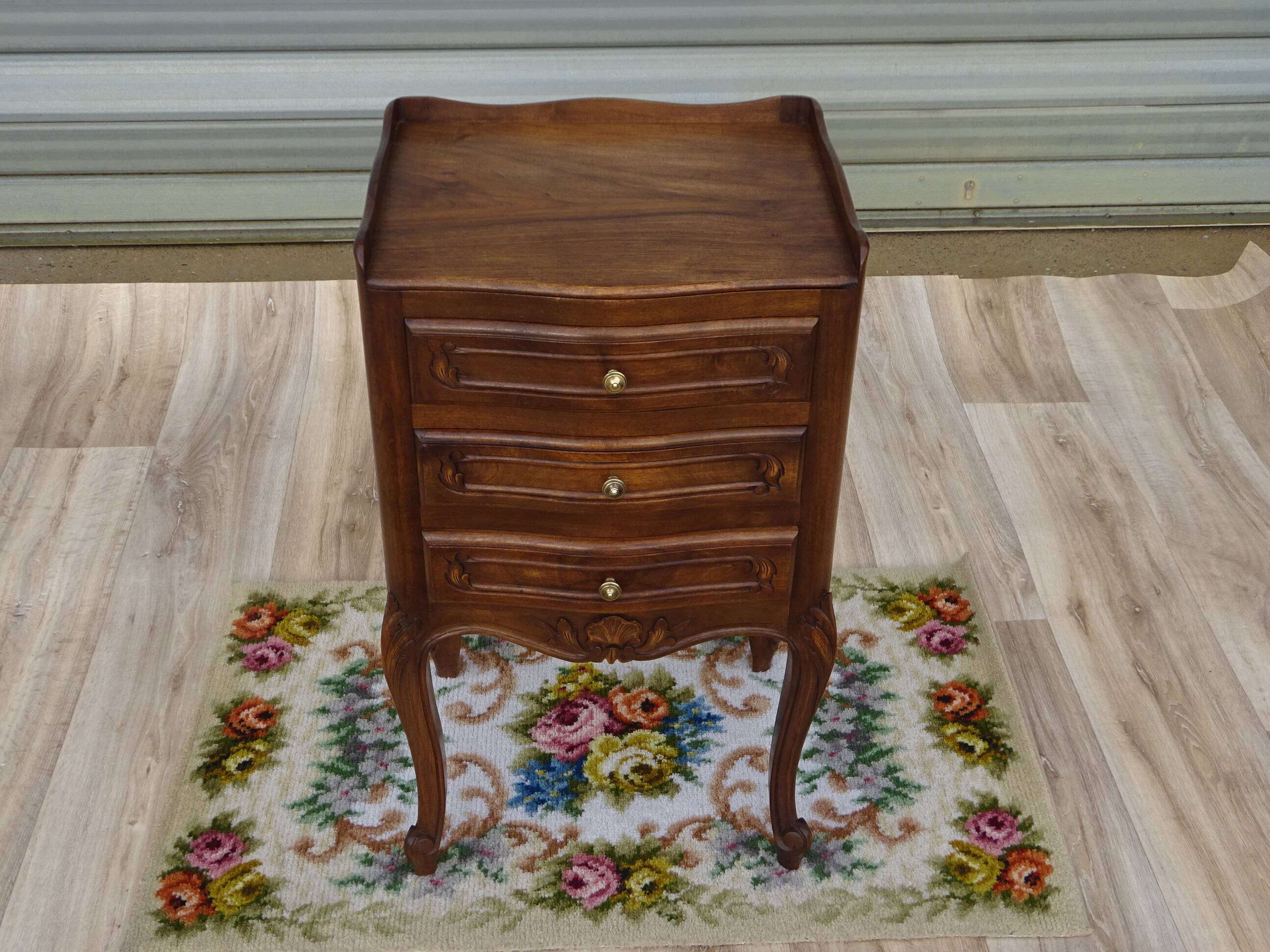 Louis XV bedside table in walnut, 3 drawers, raised edges on the tops.