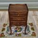 Louis XV bedside table in walnut, 3 drawers, raised edges on the tops.