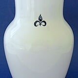 White-blue earthenware vase with stylized plant decoration