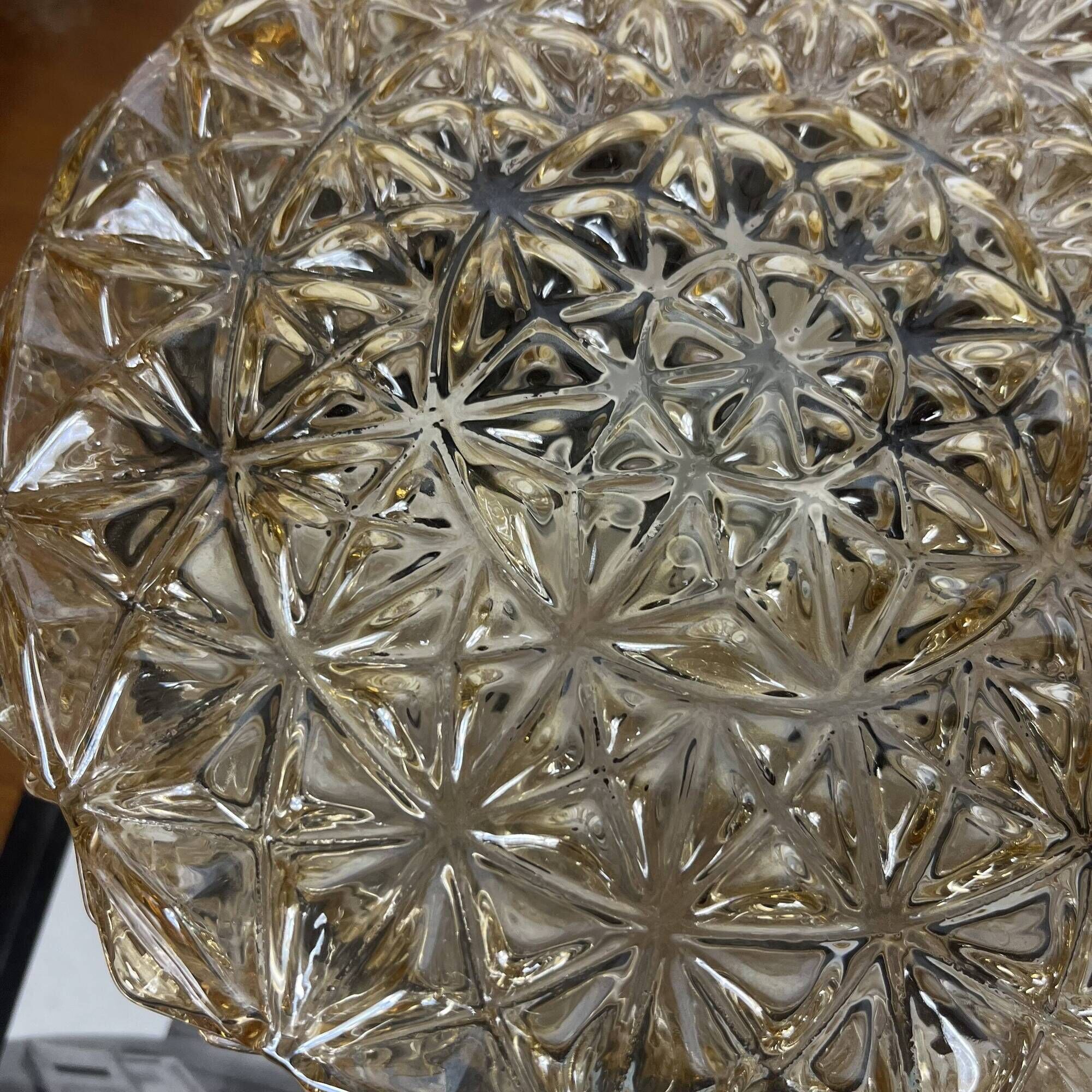 Vintage 1970s round wall light ceiling fixture with amber glass and gold.