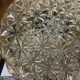 Vintage 1970s round wall light ceiling fixture with amber glass and gold.