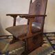 Antique Gothic Revival carved oak armchair, 1910