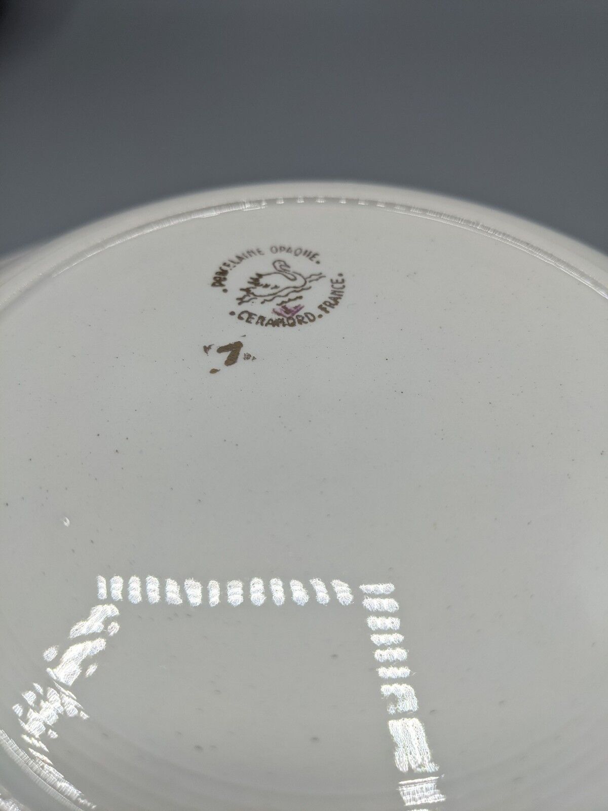 12 hollow porcelain plates, floral decoration and golden ledé - ∅: 23cm