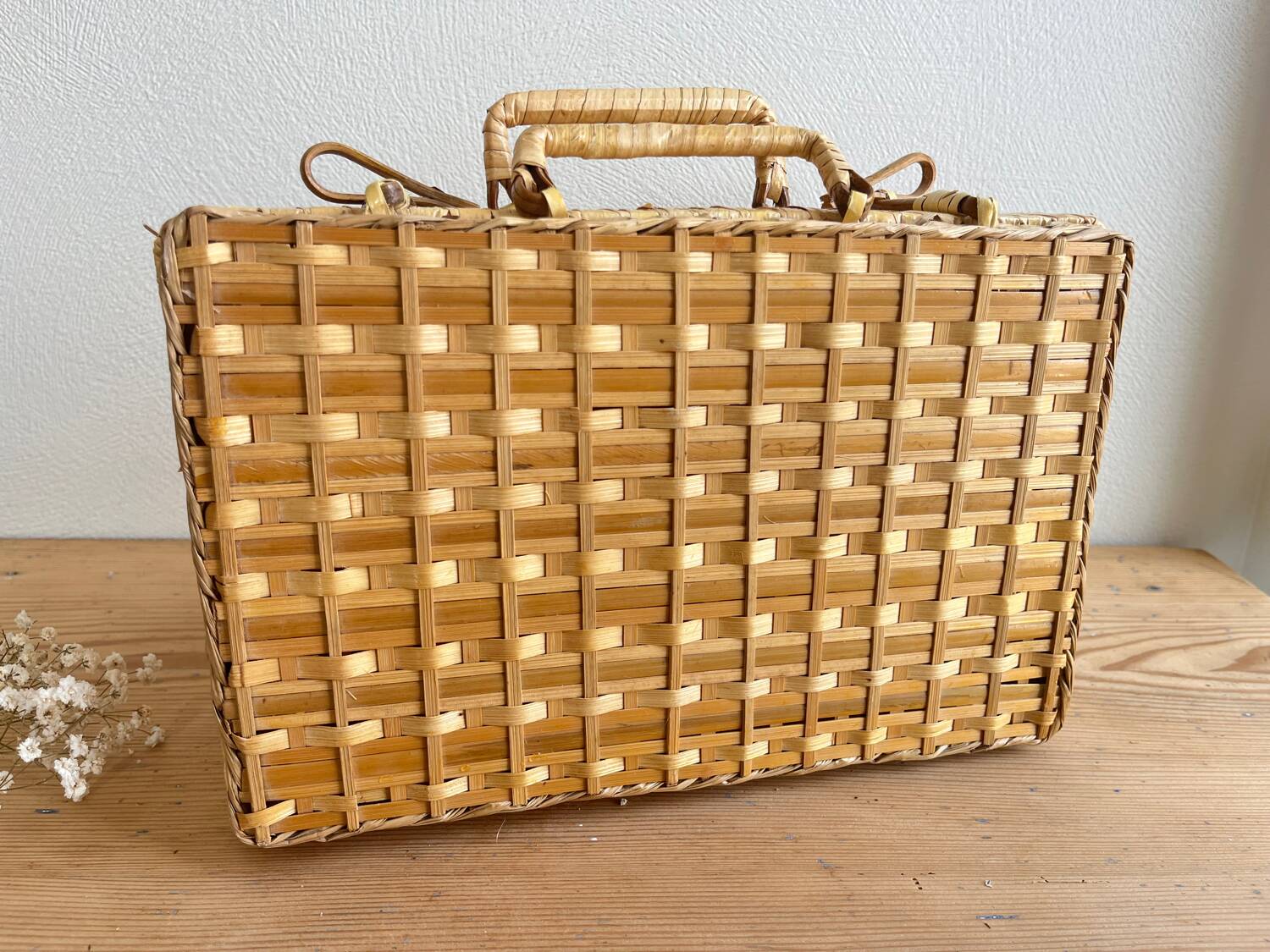 Vintage woven wicker suitcase