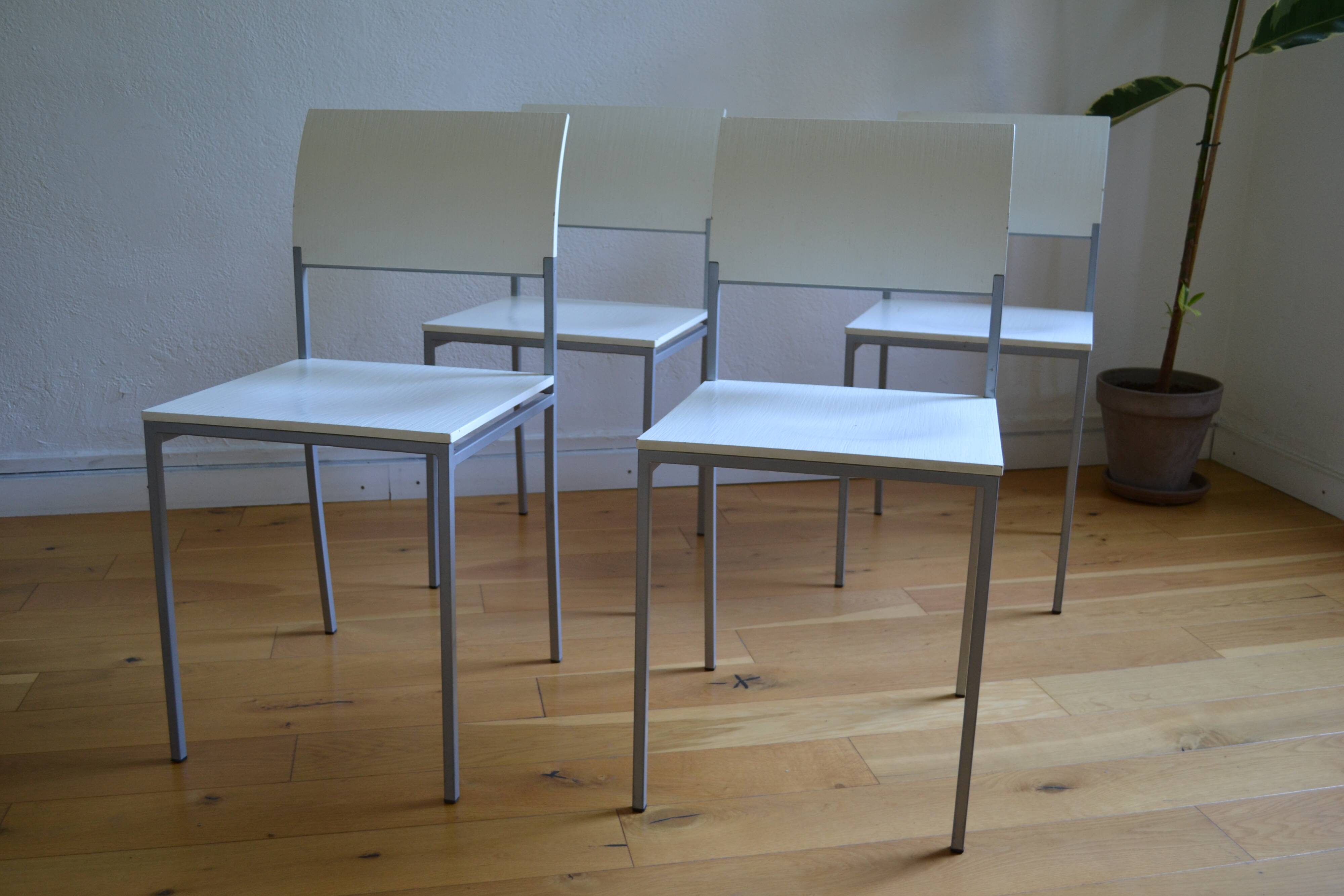 Set of 4 vintage metal and wood chairs from the 1990s.