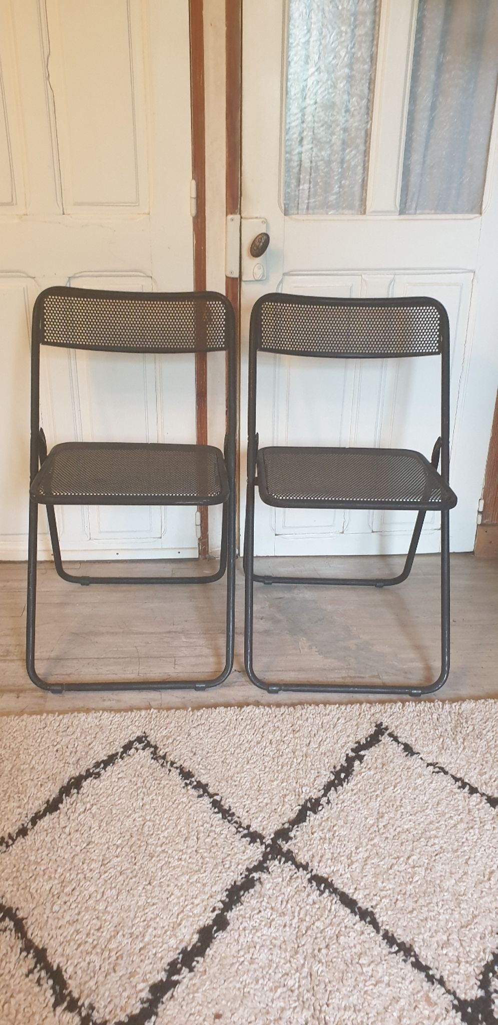 Pair of folding chairs in perforated metal
