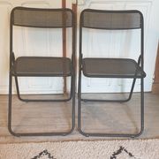 Pair of folding chairs in perforated metal