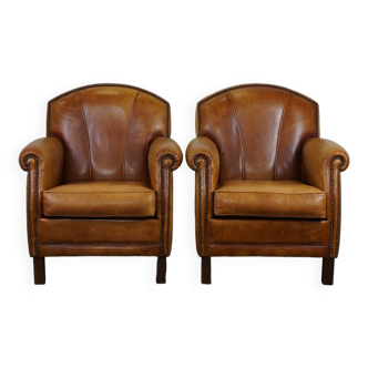 Set of 2 subtle leather armchairs in a beautiful light cognac color